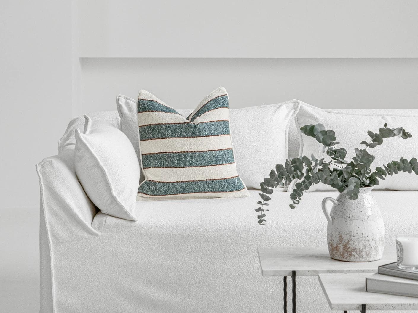 Gia Canova cushion in blue, shown in a lifestyle front view as image 4