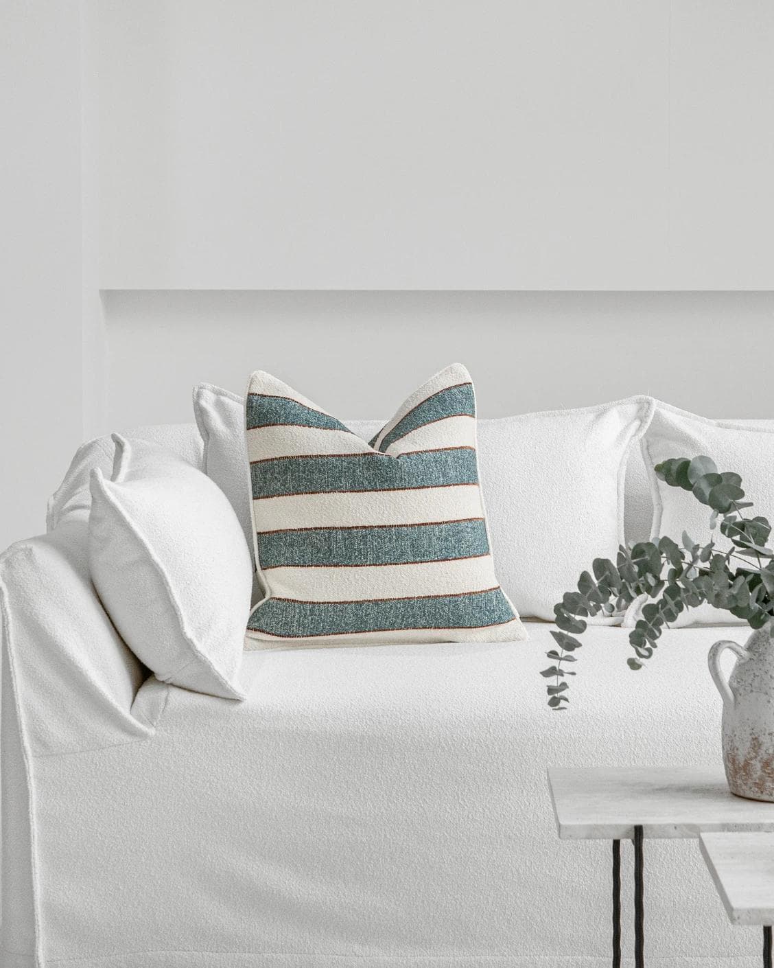 Gia Canova cushion in blue, shown in a lifestyle front view as image 4
