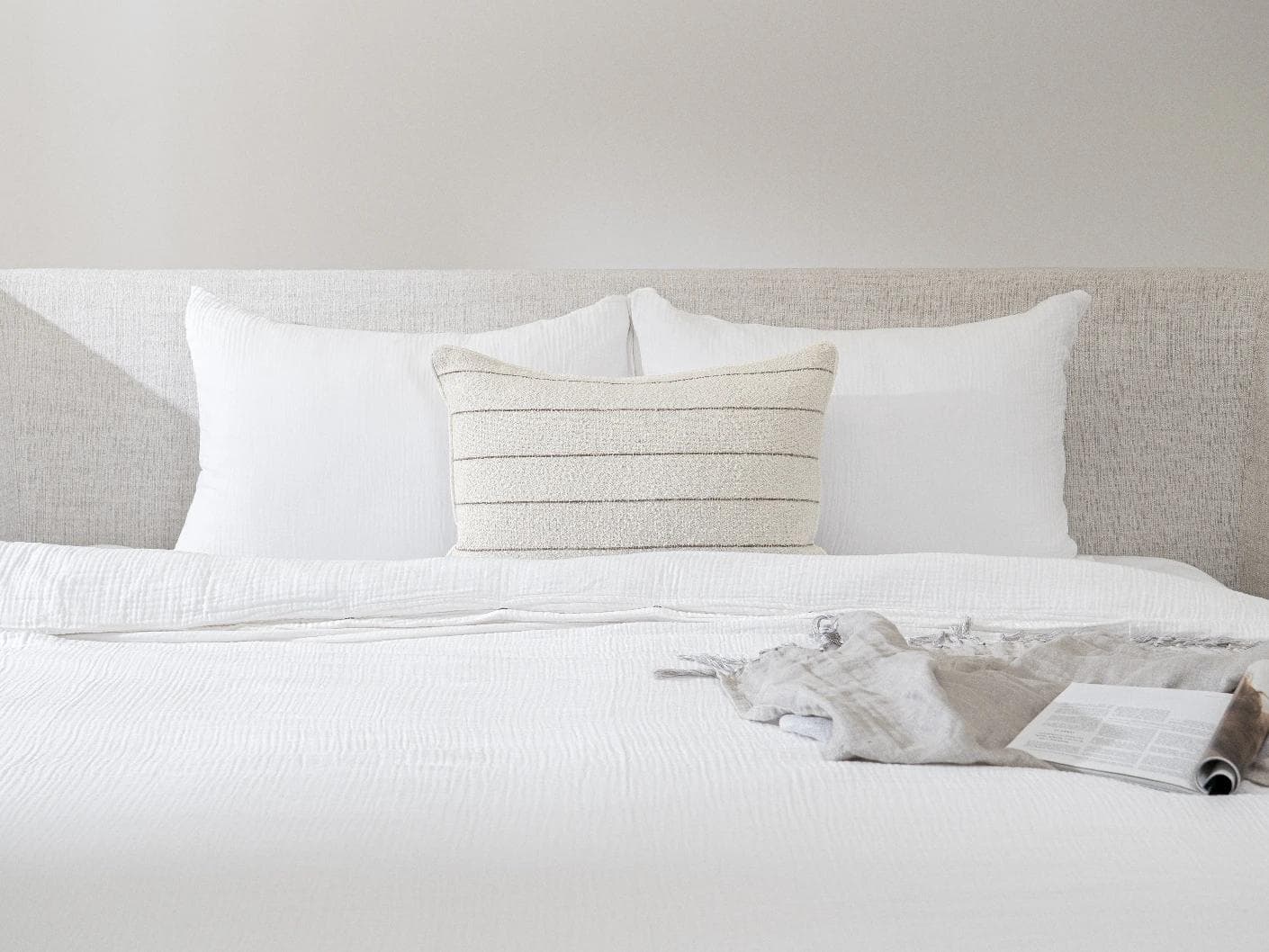 Gia Laurent III cushion in ivory, shown in a lifestyle front view as image 2
