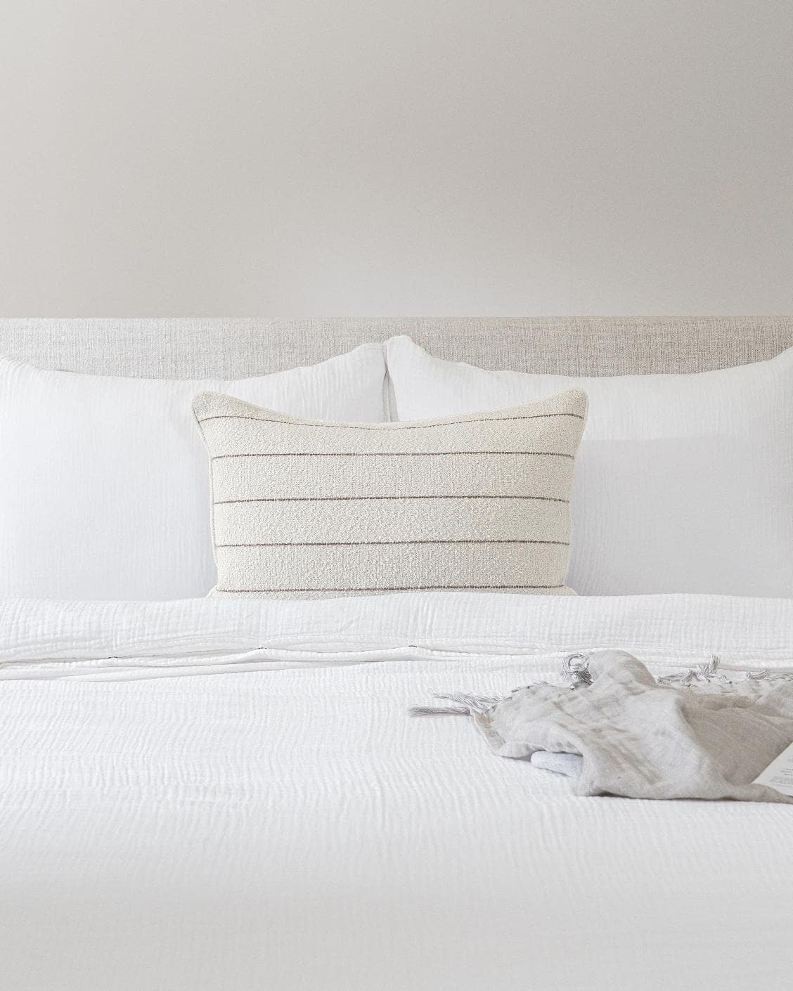 Gia Laurent III cushion in ivory, shown in a lifestyle front view as image 2