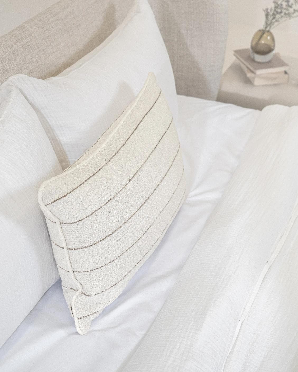 Gia Laurent III cushion in ivory, shown in a lifestyle top view as image 5