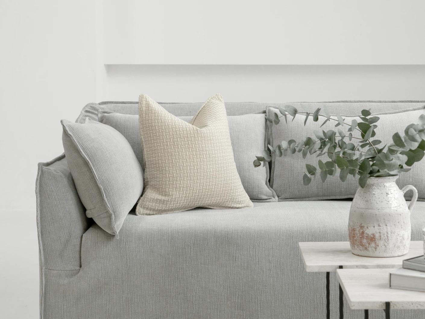 Gigi Laurent cushion in ivory, shown in a lifestyle front view as image 4
