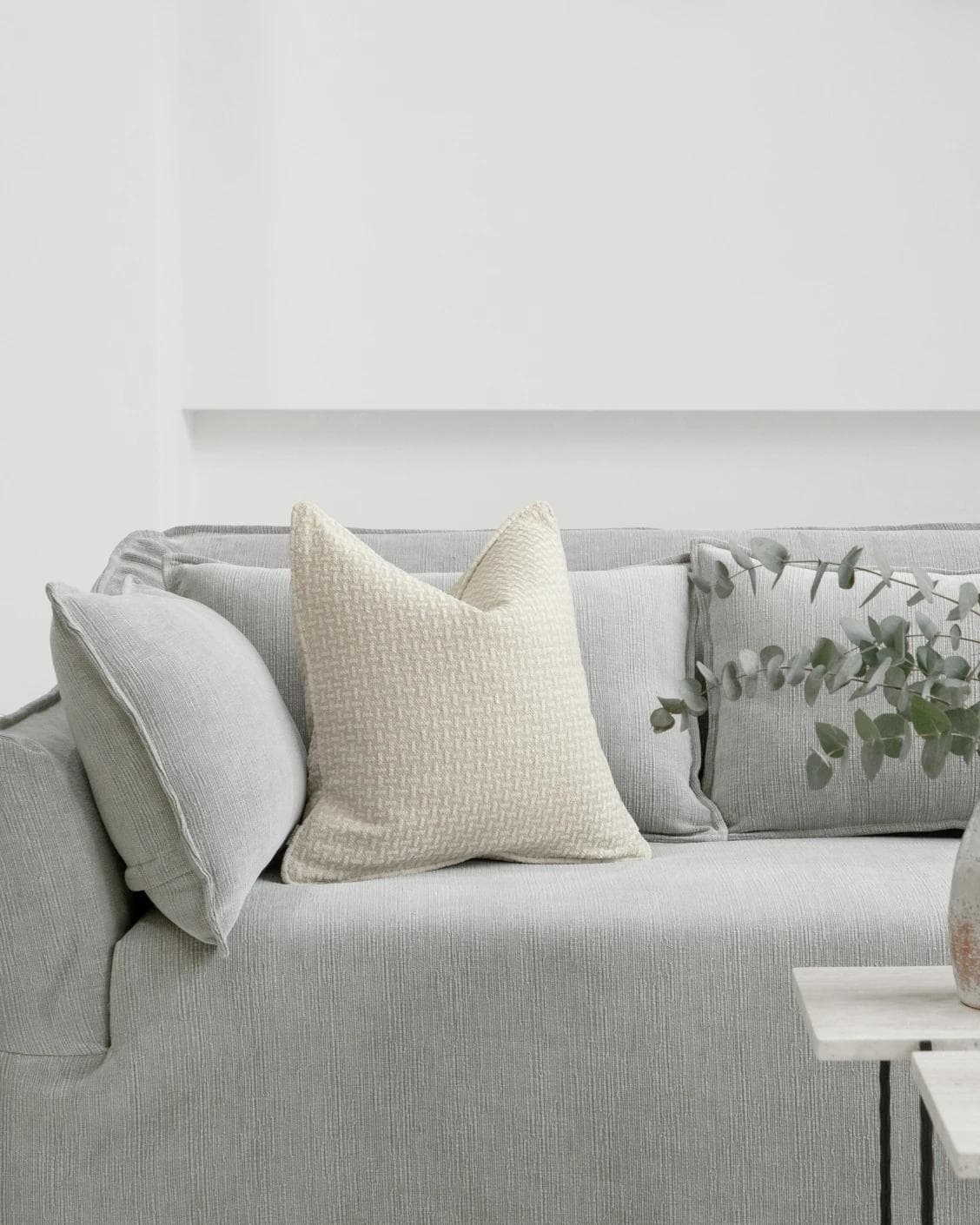 Gigi Laurent cushion in ivory, shown in a lifestyle front view as image 4