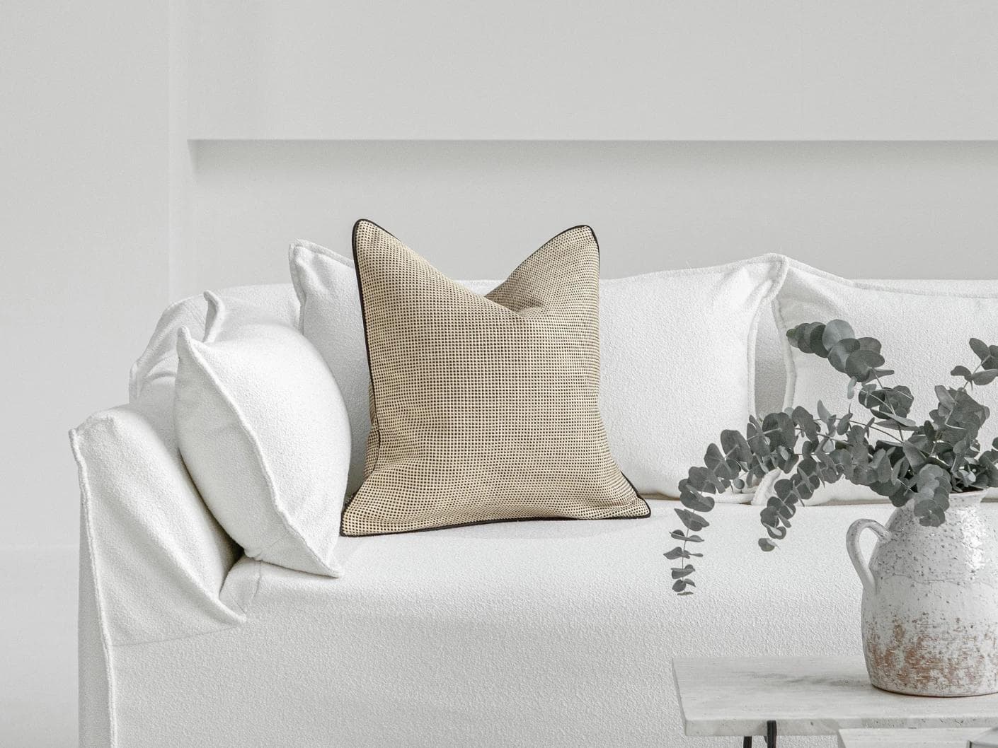 Ginny Laurent cushion in cream, shown in a lifestyle front view as image 4