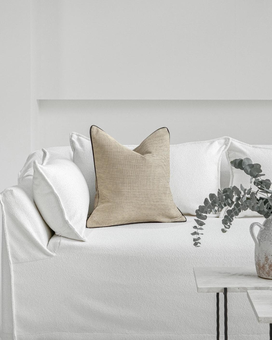 Ginny Laurent cushion in cream, shown in a lifestyle front view as image 4