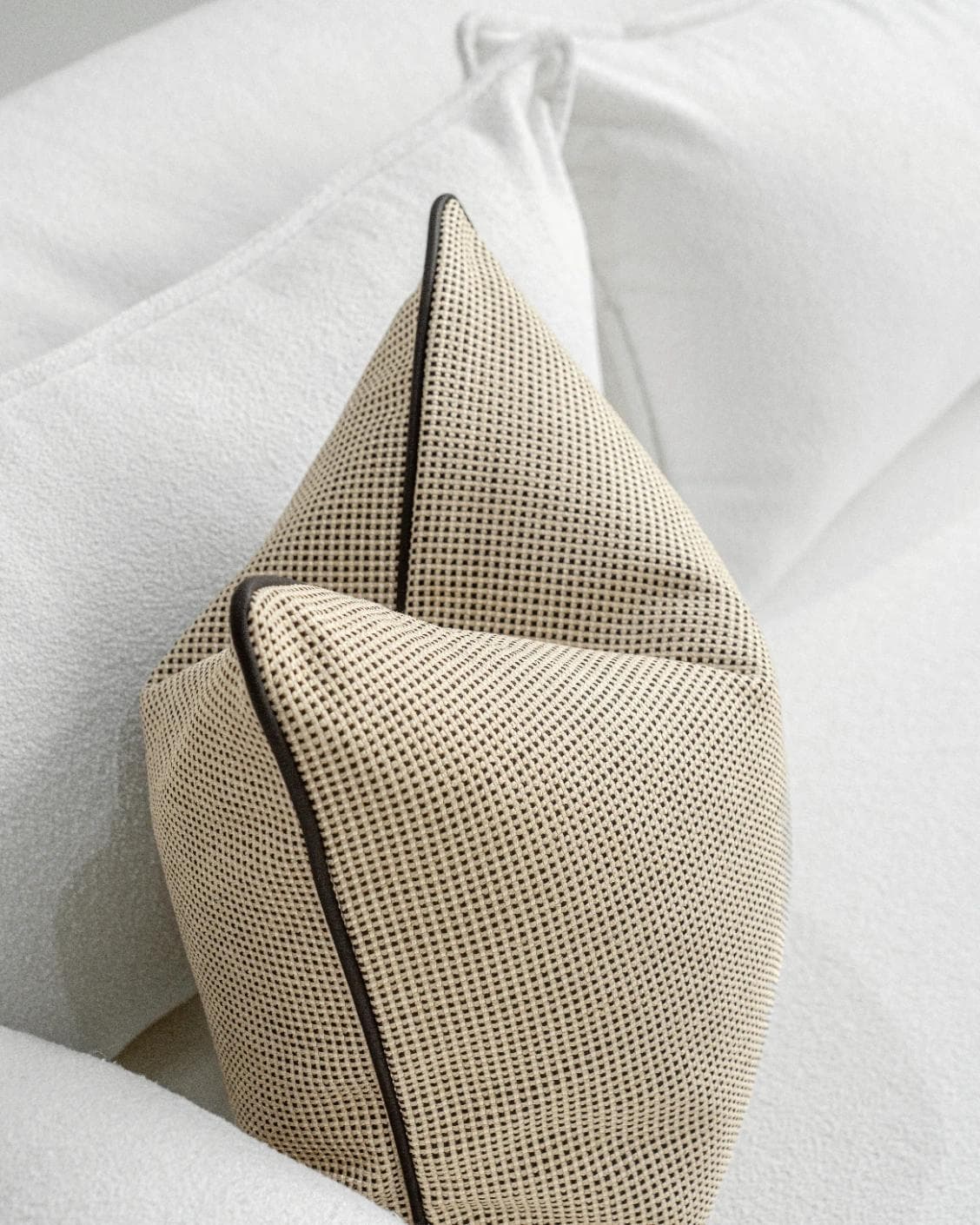 Ginny Laurent cushion in cream, shown in a lifestyle top view as image 5
