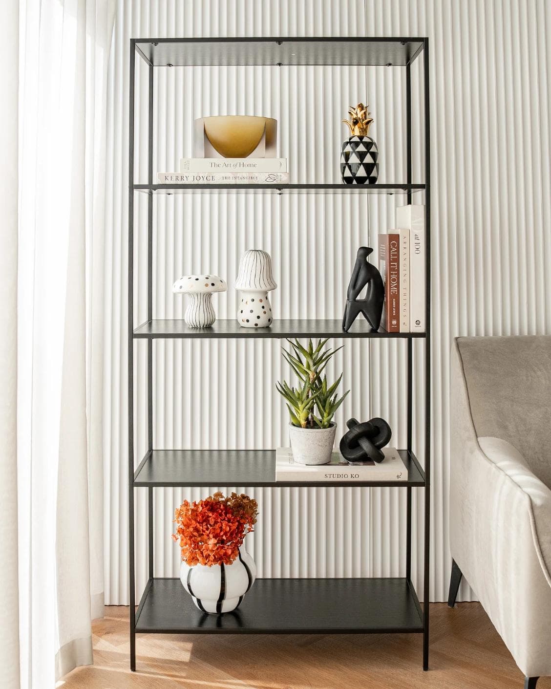 Hakim Arneson statues and sculptures in black, shown in a lifestyle front view as image 4