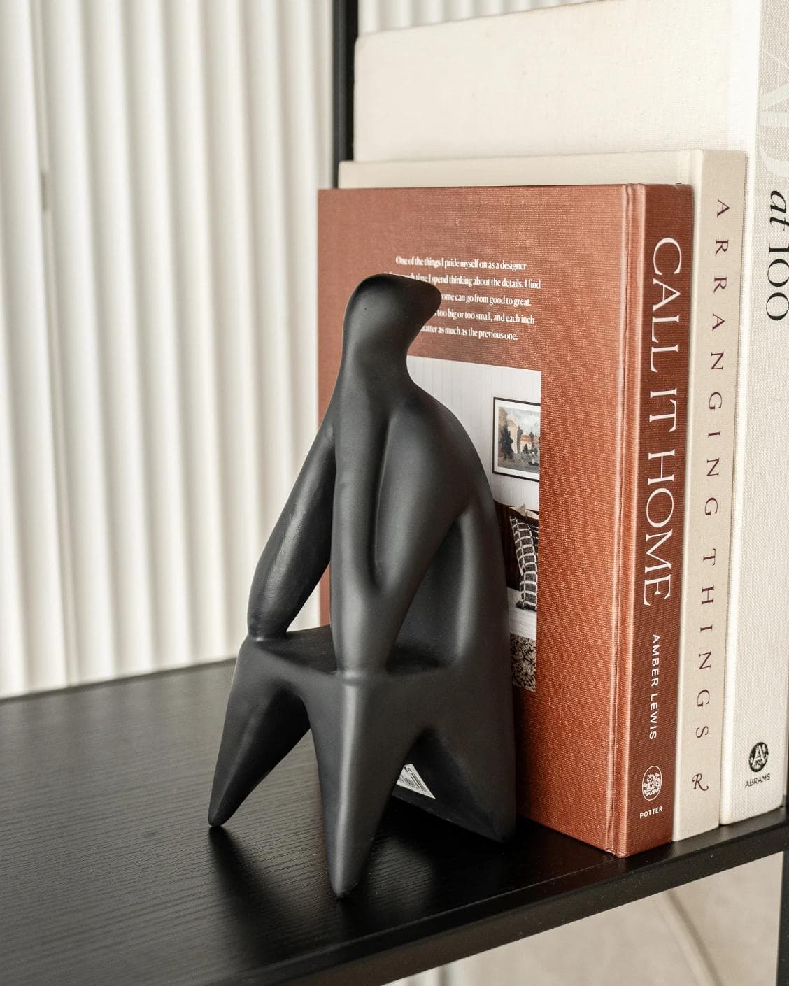 Hakim Arneson statues and sculptures in black, shown in a lifestyle left view as image 5