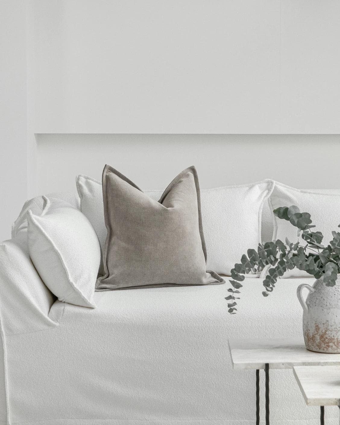 Haley Laurent cushion in grey and taupe, shown in a lifestyle front view as image 4
