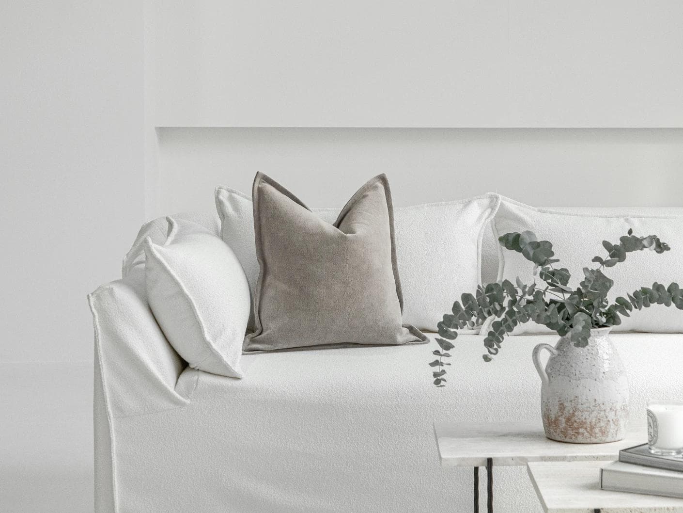 Haley Laurent cushion in grey and taupe, shown in a lifestyle front view as image 4