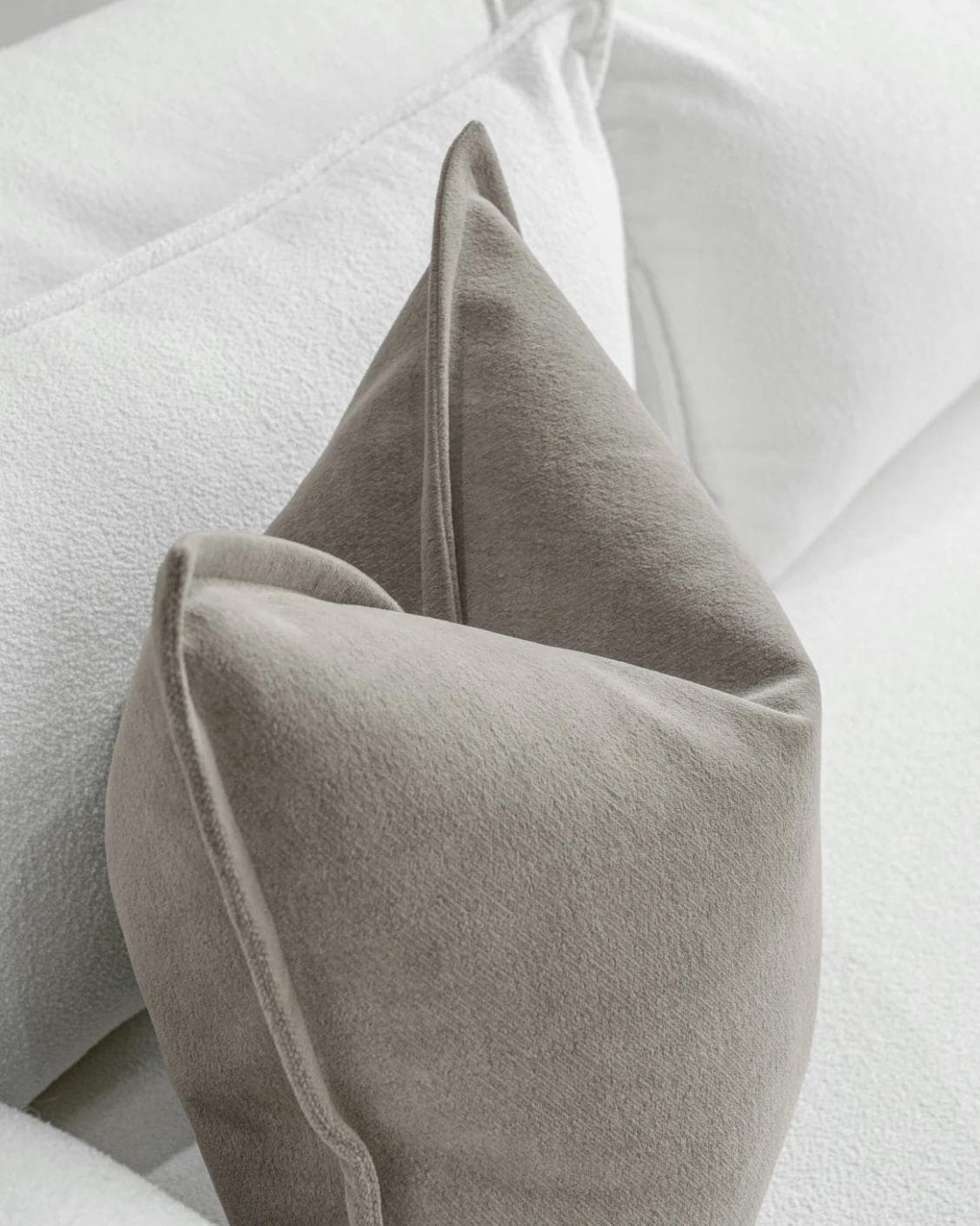 Haley Laurent cushion in grey and taupe, shown in a lifestyle top view as image 5