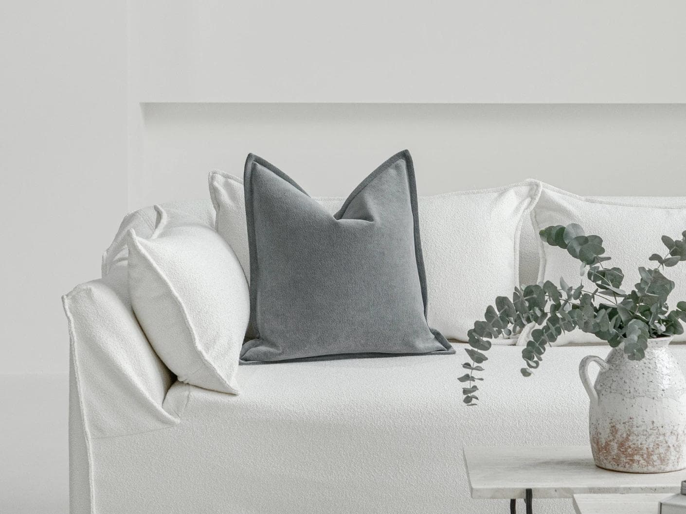 Haley Lucas cushion in azure and grey, shown in a lifestyle front view as image 4