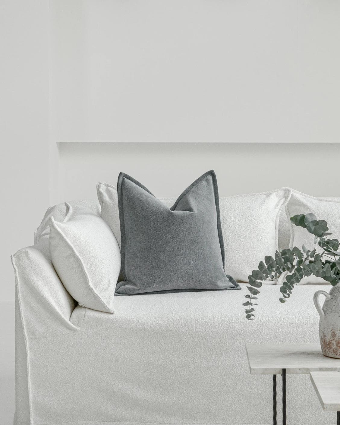 Haley Lucas cushion in azure and grey, shown in a lifestyle front view as image 4