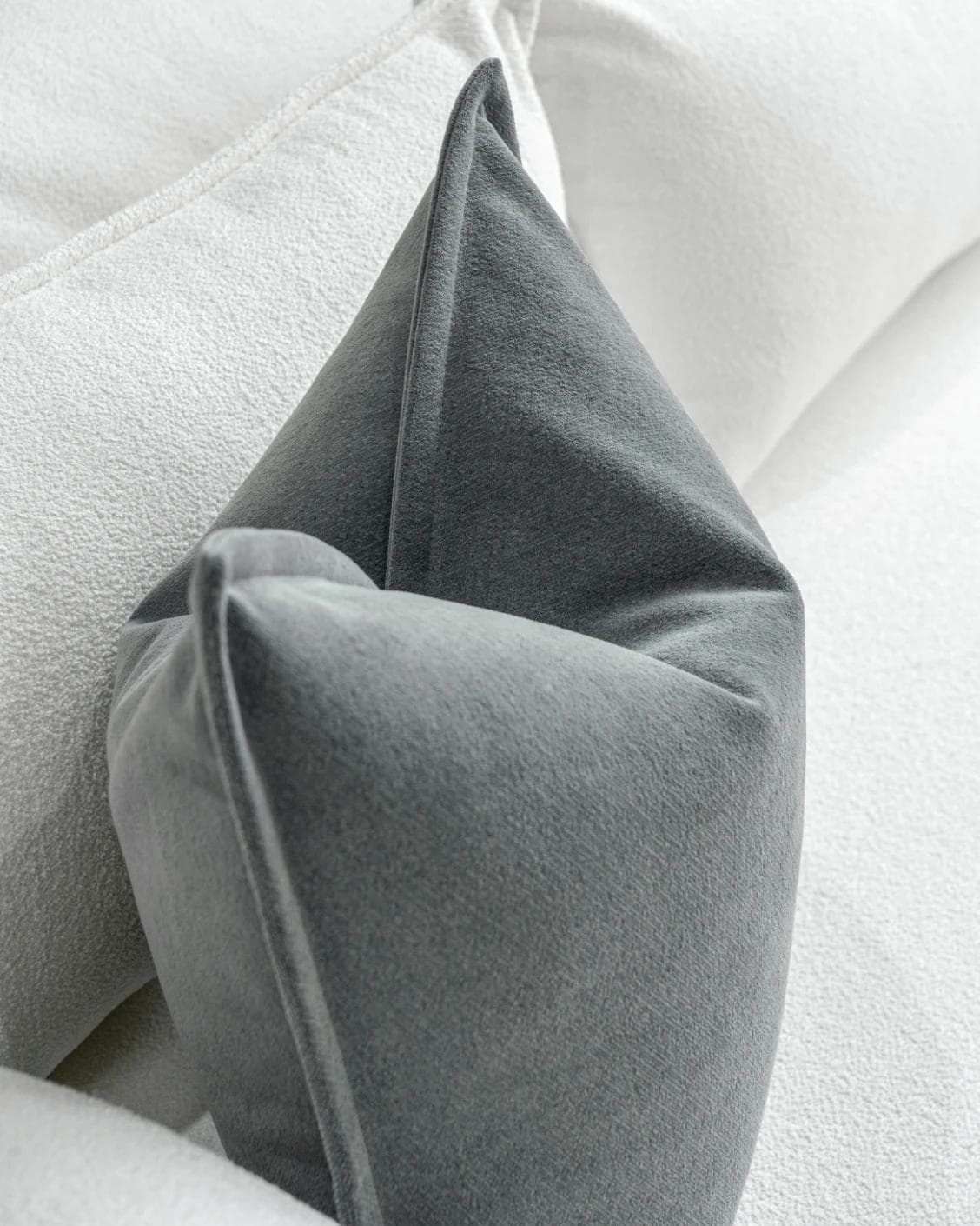 Haley Lucas cushion in azure and grey, shown in a lifestyle top view as image 5
