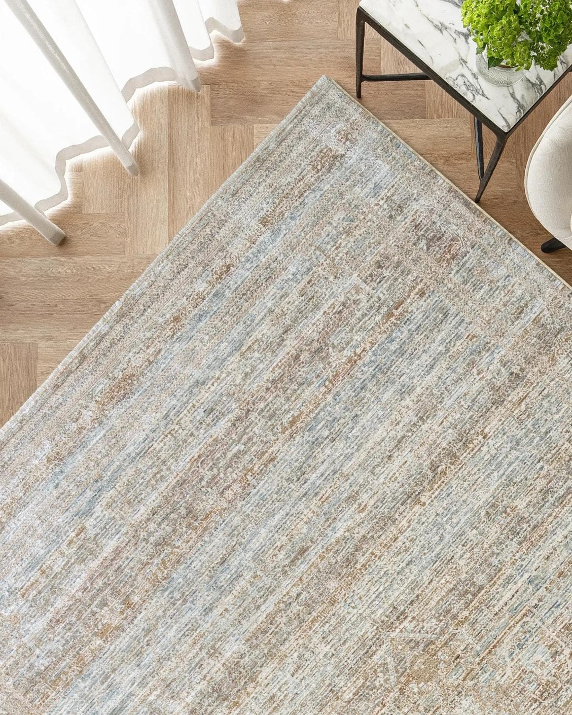 Hana Rust carpet, shown in a lifestyle top view as image 2