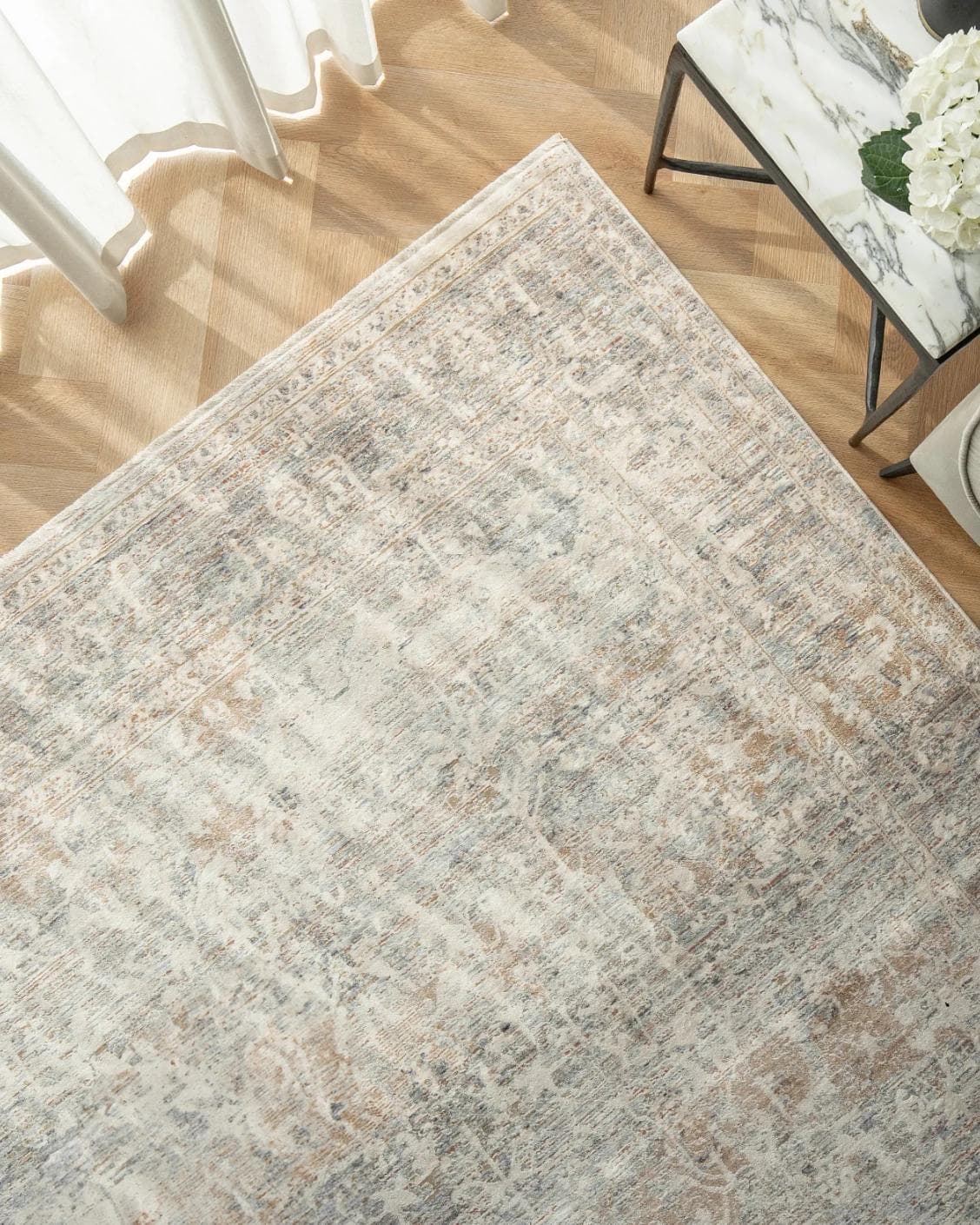 Hana Sandy carpet in beige and taupe, shown in a lifestyle top view as image 2