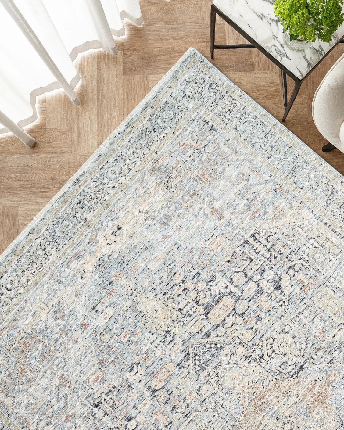 Hana Sky carpet in blue and grey, shown in a lifestyle top view as image 2