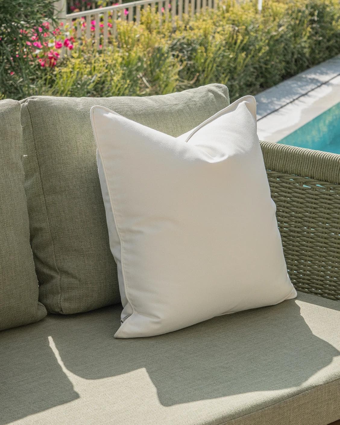 Haneen Bundle cushion in rust and ivory, shown in a lifestyle left view as image 6