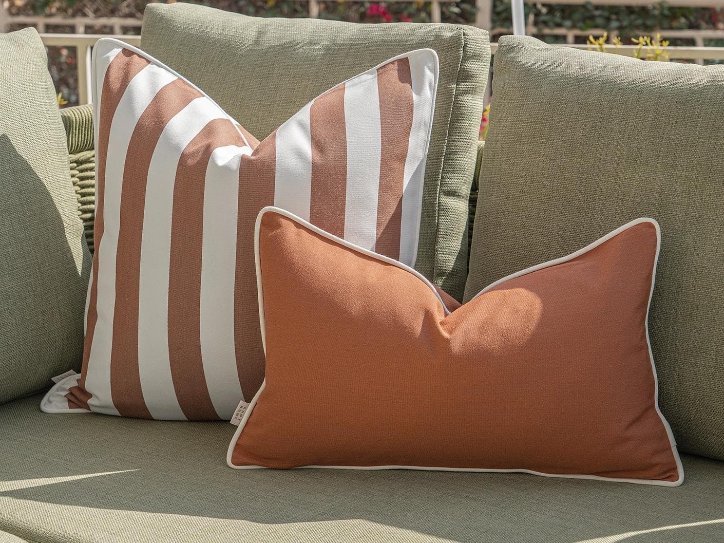 Haneen Bundle cushion in rust and ivory, shown in a lifestyle right view as image 7