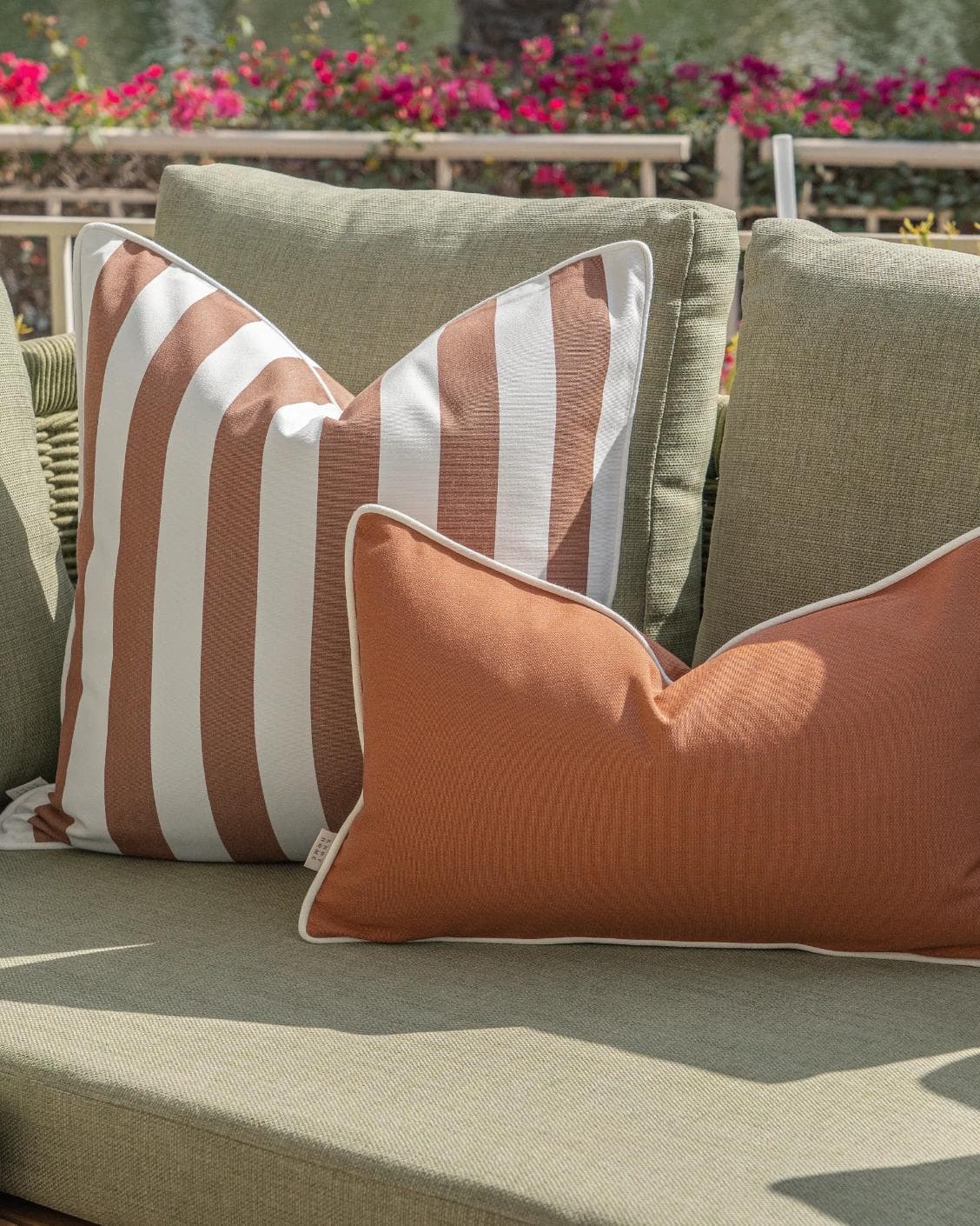 Haneen Bundle cushion in rust and ivory, shown in a lifestyle right view as image 7
