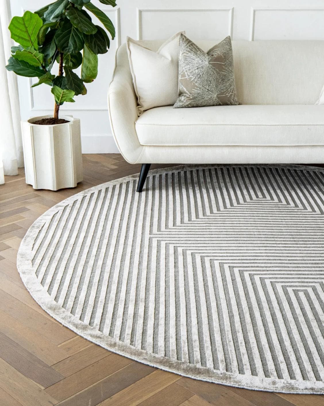Harf Noon Ashton Round carpet in grey, shown in a lifestyle front view