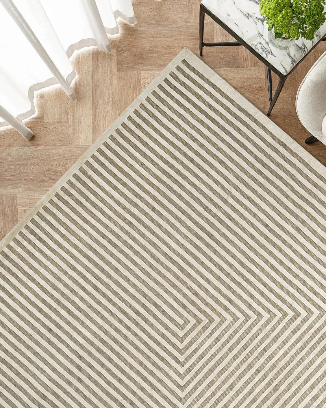 Harf Noon Sandy carpet in beige and ivory, shown in a lifestyle top view as image 2
