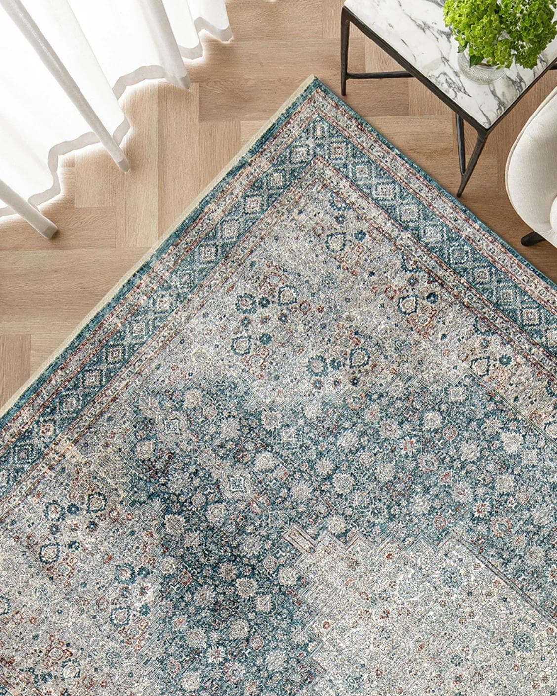 Harper Sky carpet in blue, shown in a lifestyle top view as image 2