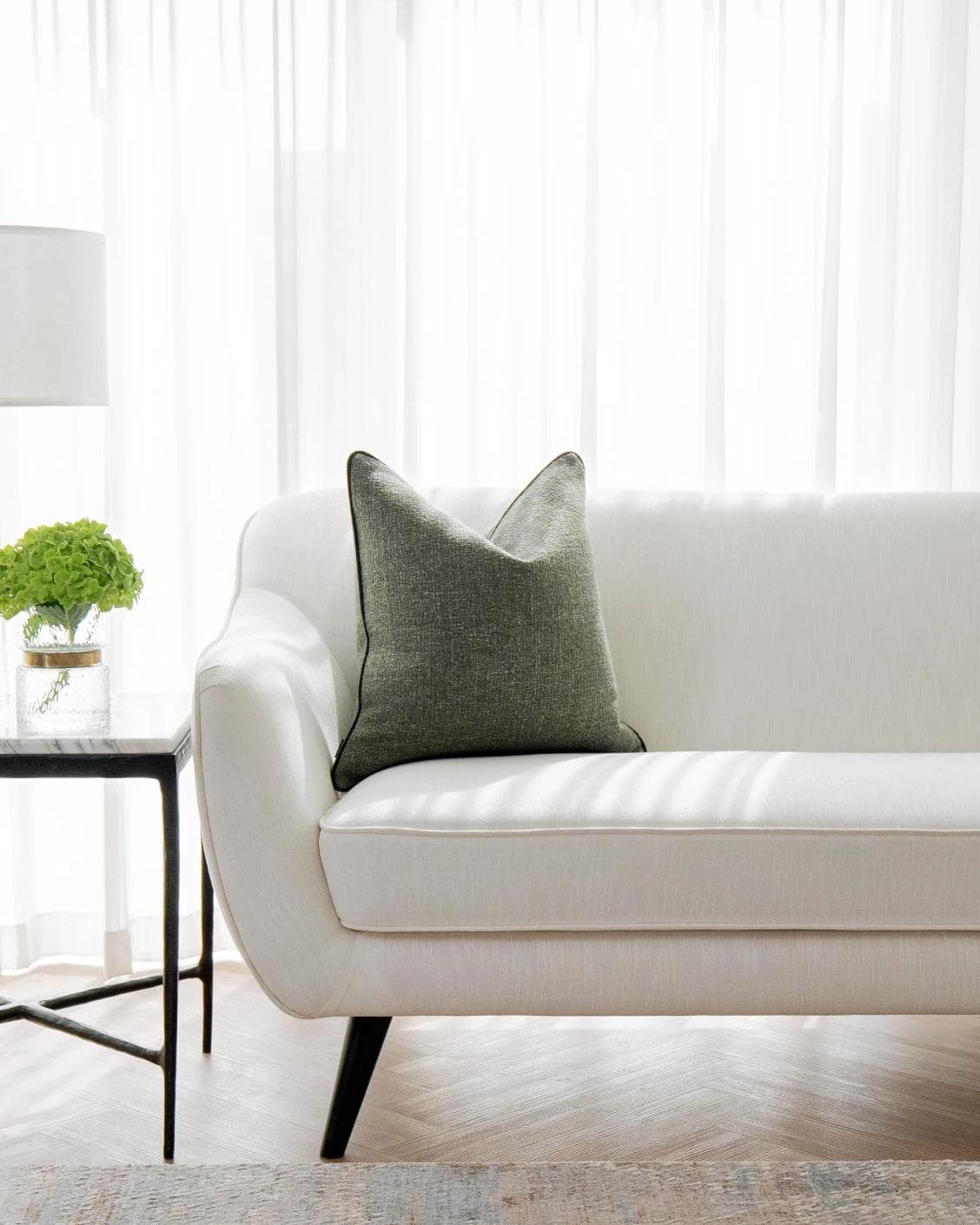 Harrison Sage cushion in green, shown in a lifestyle as image 4