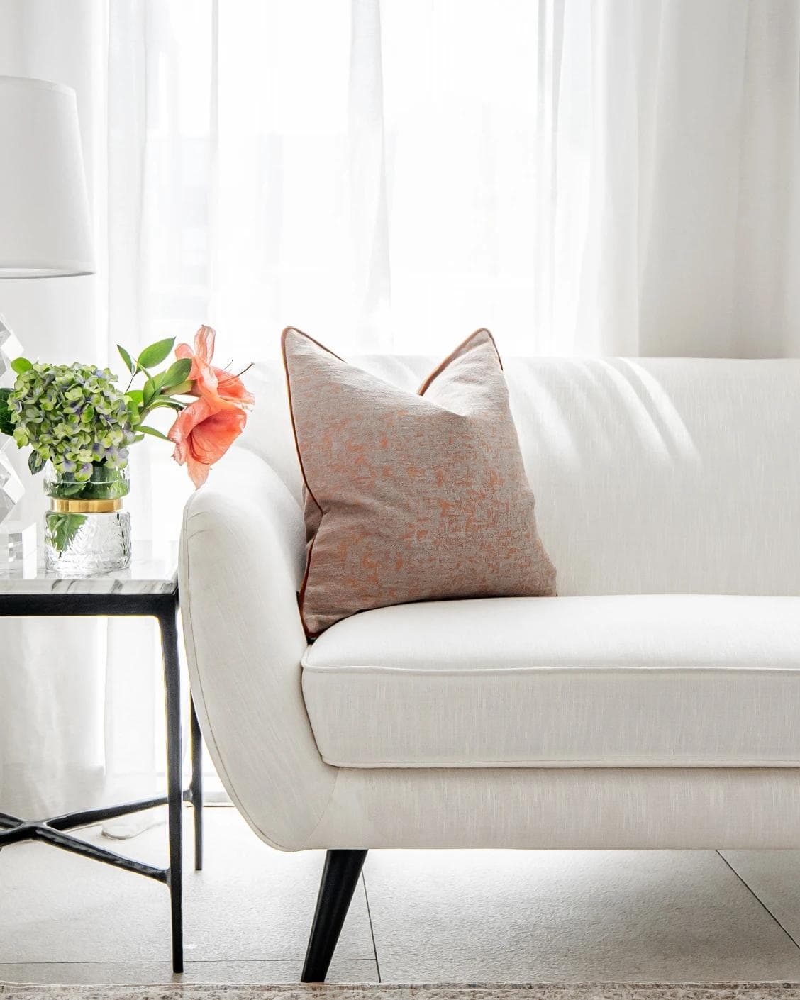 Hazel Tangelo cushion in orange and red, shown in a lifestyle front view as image 4