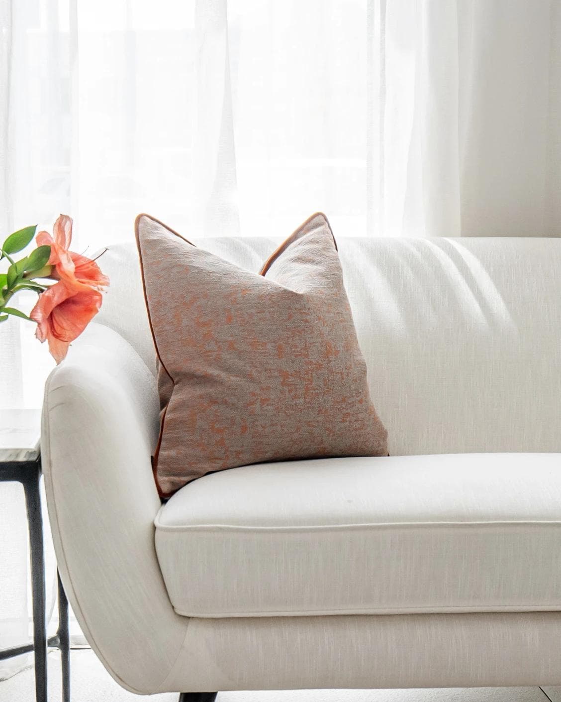 Hazel Tangelo cushion in orange and red, shown in a lifestyle front view as image 5