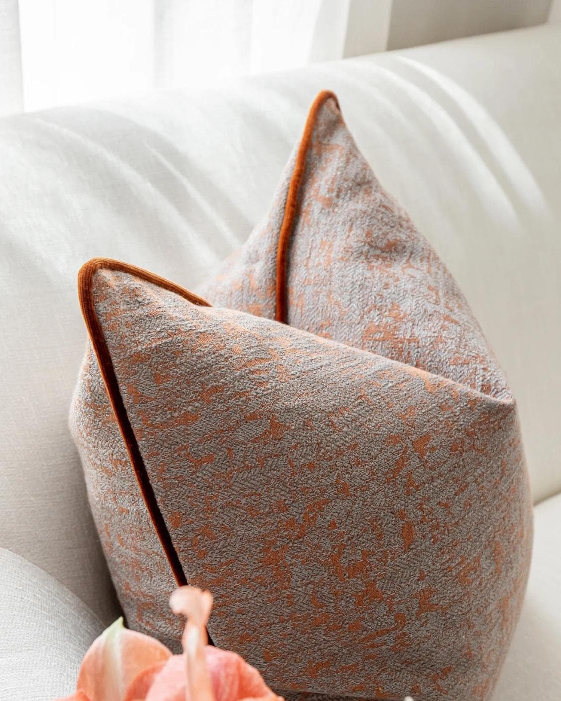Hazel Tangelo cushion in orange and red, shown in a lifestyle left view as image 6