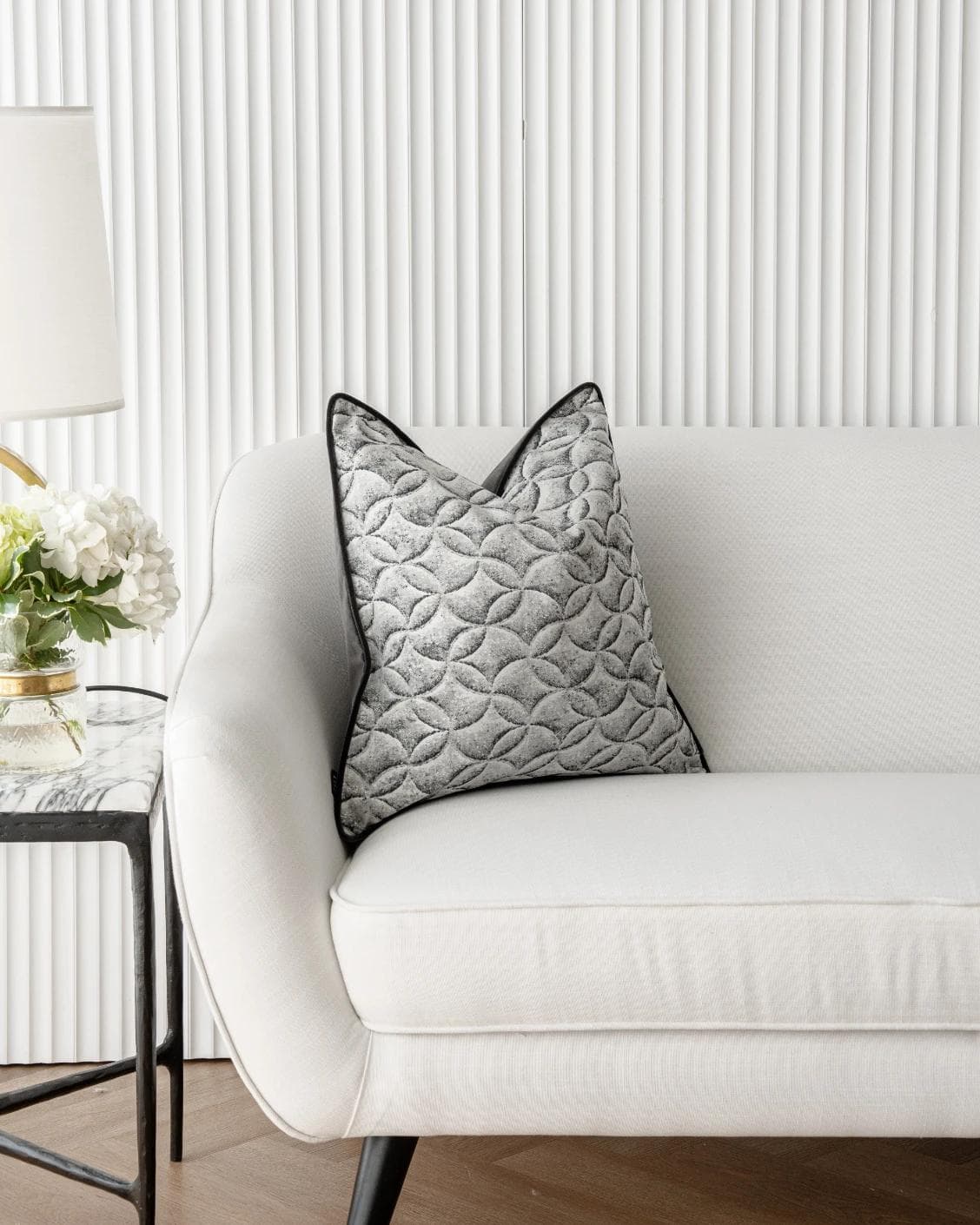 Heera Steele cushion in white and black, shown in a lifestyle front view as image 4