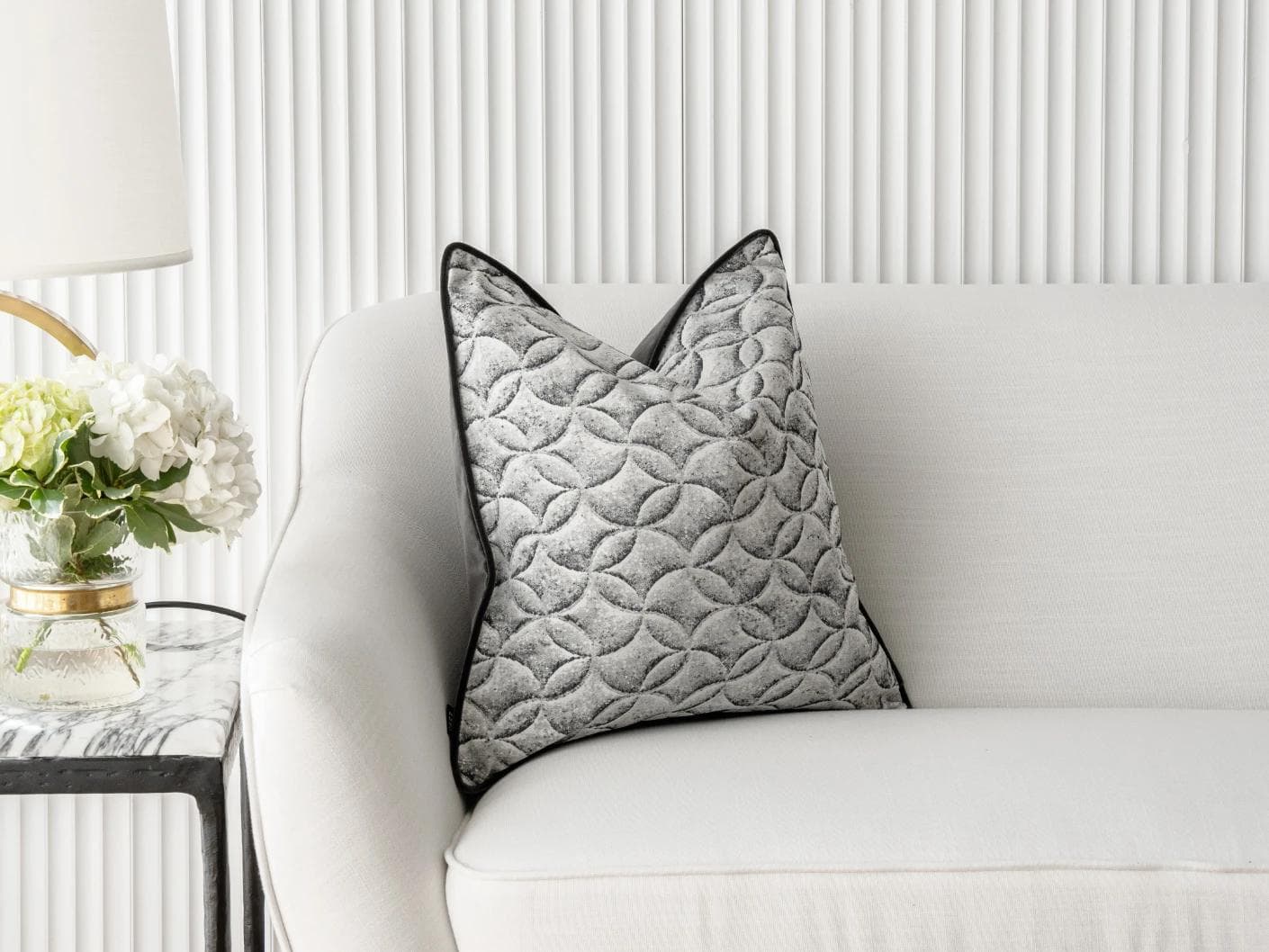 Heera Steele cushion in white and black, shown in a lifestyle front view as image 4