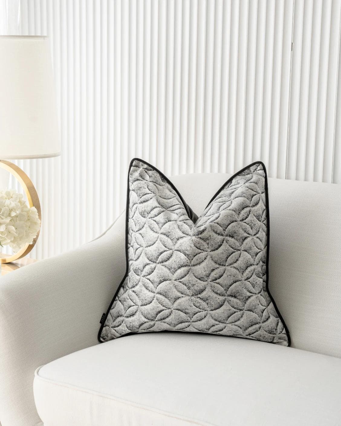 Heera Steele cushion in white and black, shown in a lifestyle front view as image 5