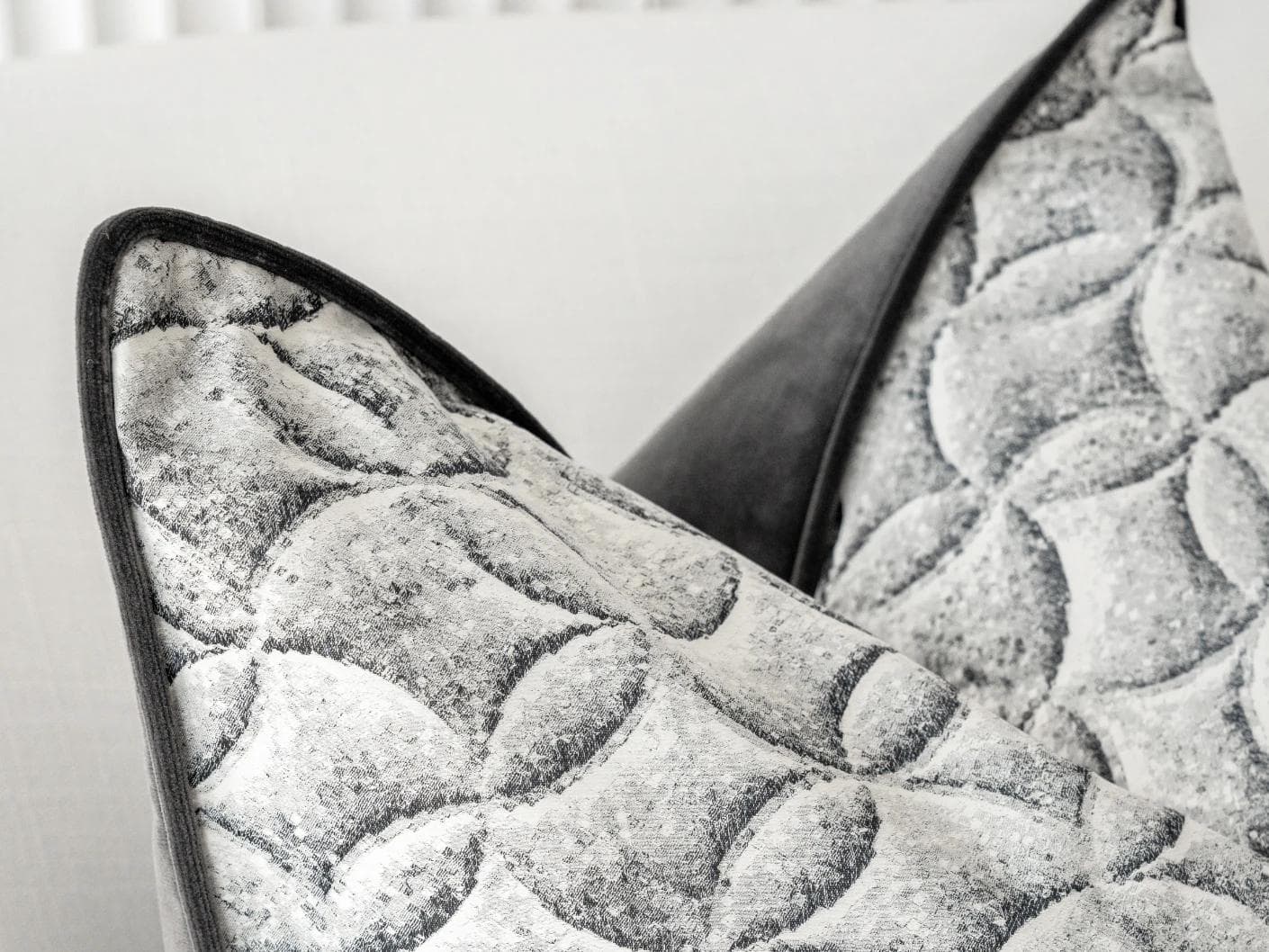 Heera Steele cushion in white and black, shown in a lifestyle left view as image 6