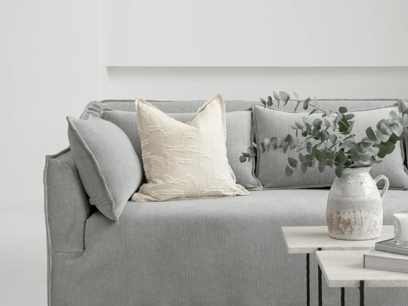 Heeth Laurent cushion in cream and ivory, shown in a lifestyle front view as image 4