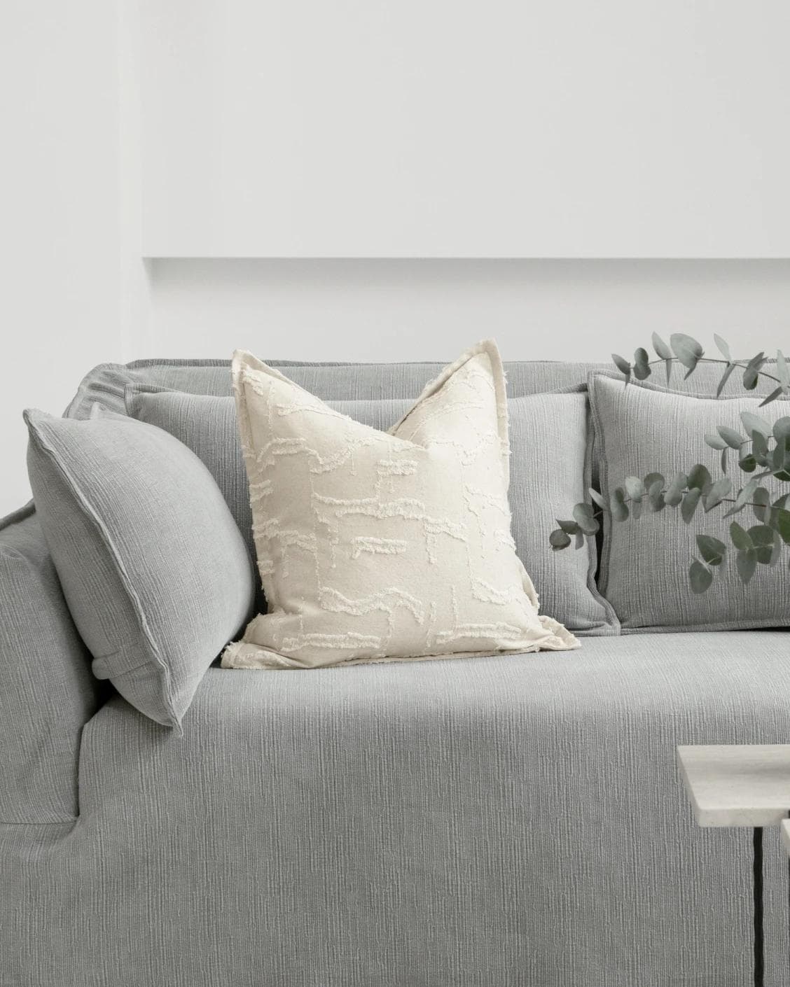 Heeth Laurent cushion in cream and ivory, shown in a lifestyle front view as image 4