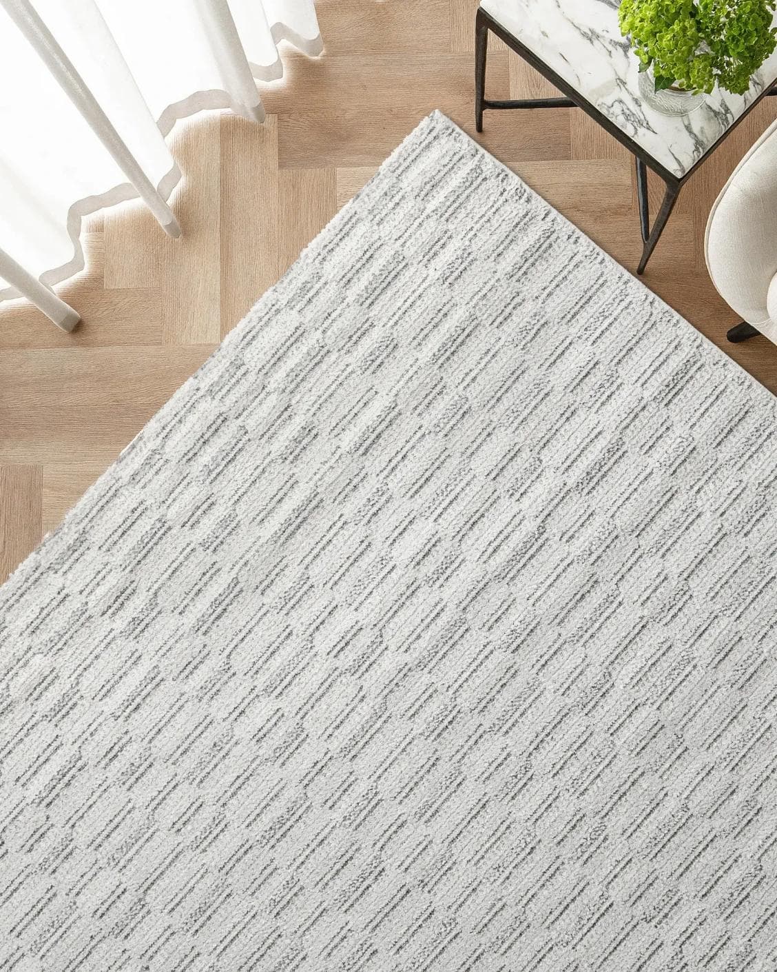 Henry Alba carpet in ivory and grey, shown in a lifestyle top view as image 2