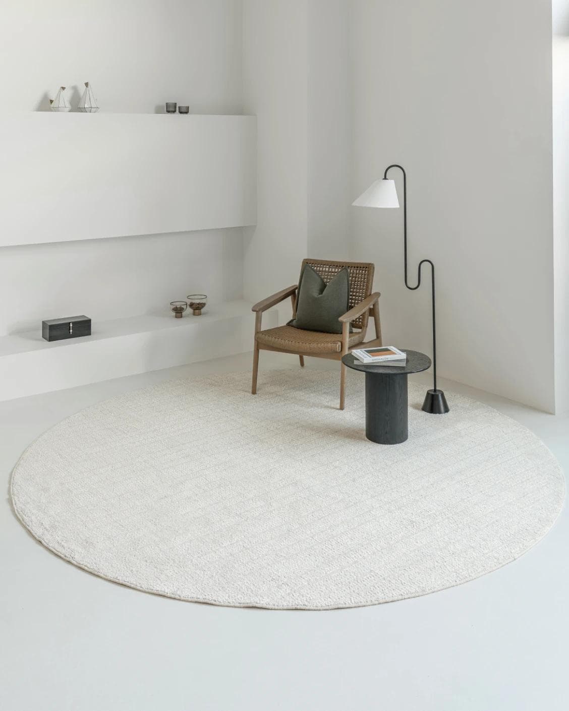Henry Bianca Round carpet in ivory and pearl, shown in a lifestyle front view