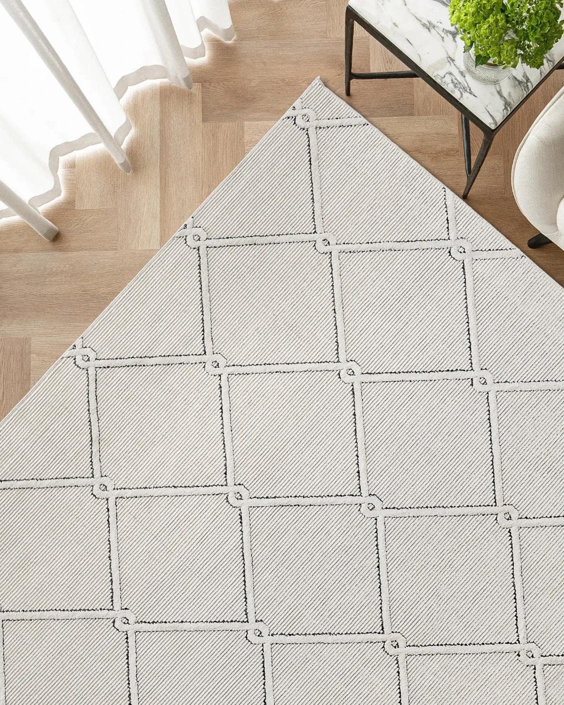 Henry Dusty carpet in ivory and charcoal, shown in a lifestyle top view as image 2