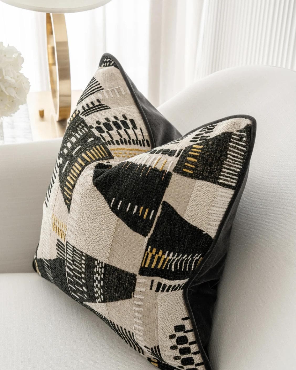 Hilda Steele cushion in black and beige, shown in a lifestyle right view as image 5