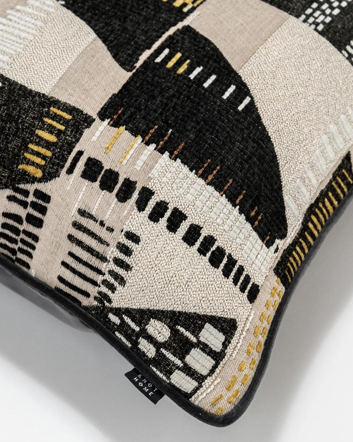 Hilda Steele cushion in black and beige, shown in a product top view as image 8