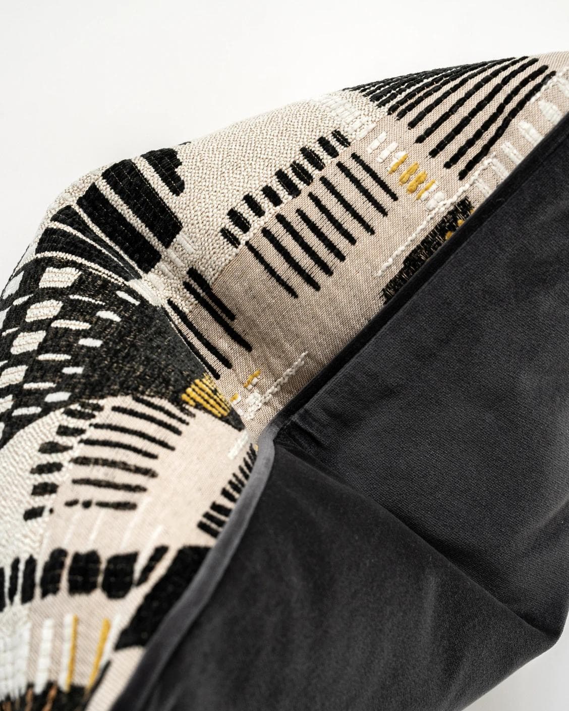 Hilda Steele cushion in black and beige, shown in a product top view as image 9