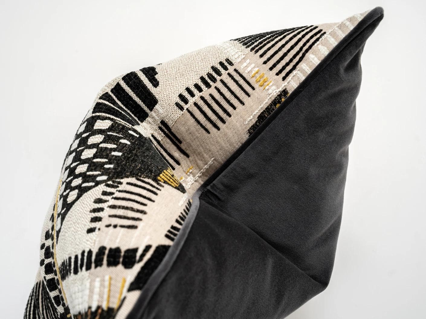 Hilda Steele cushion in black and beige, shown in a product top view as image 9