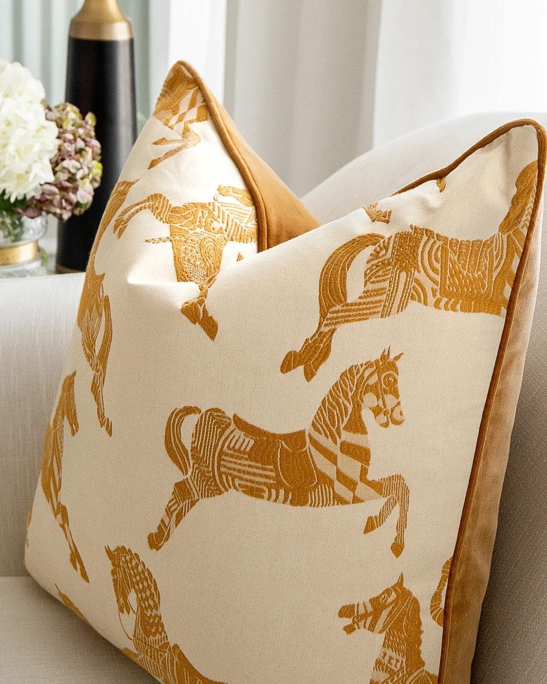 Arie Bundle cushion in orange and beige, shown in a lifestyle right view as image 5