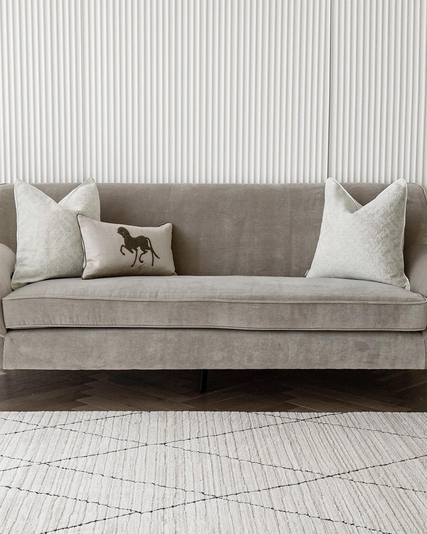 Luther Bundle cushion in white, brown and beige, shown in a lifestyle front view as image 4