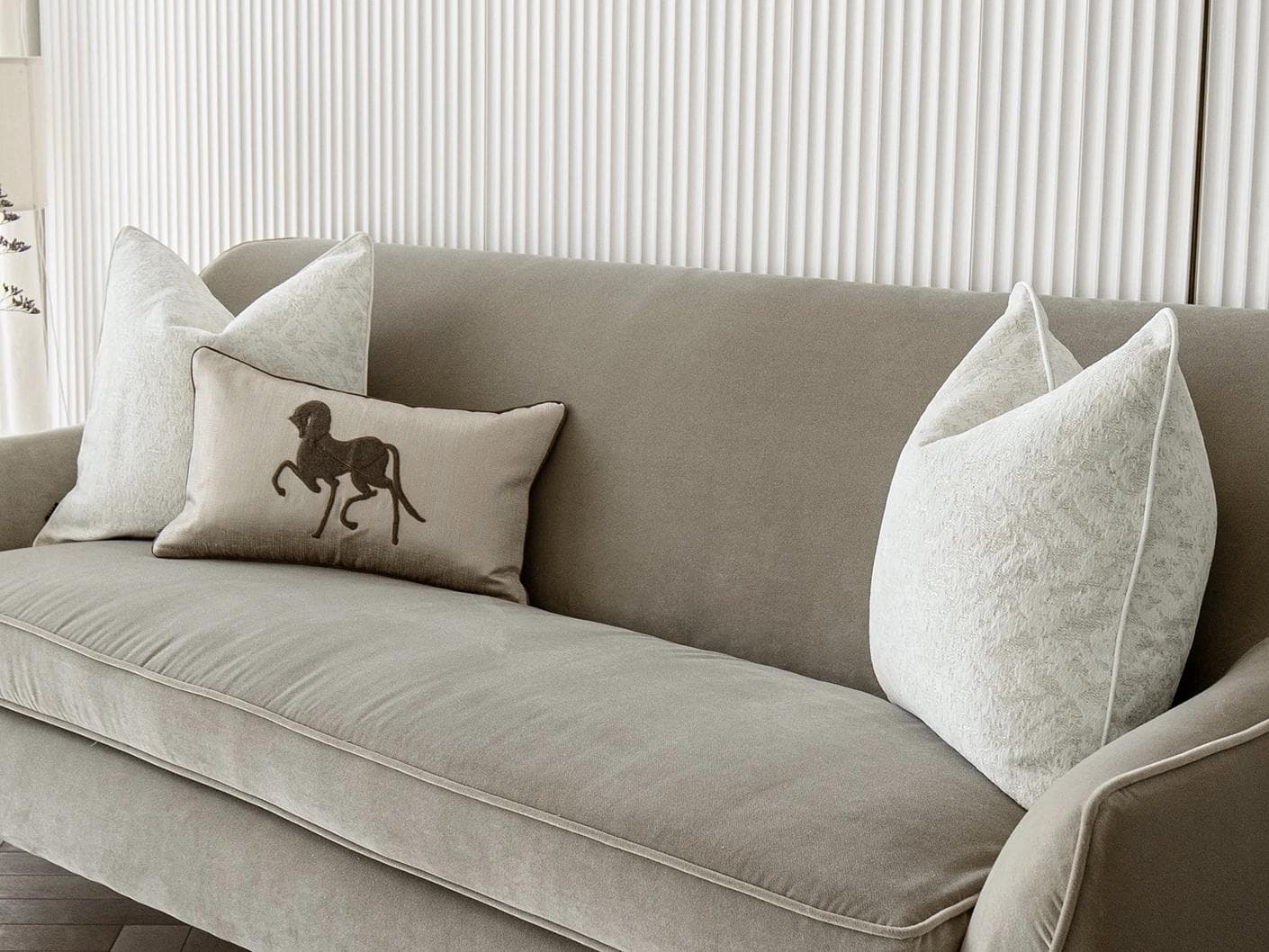 Luther Bundle cushion in white, brown and beige, shown in a lifestyle right view as image 2