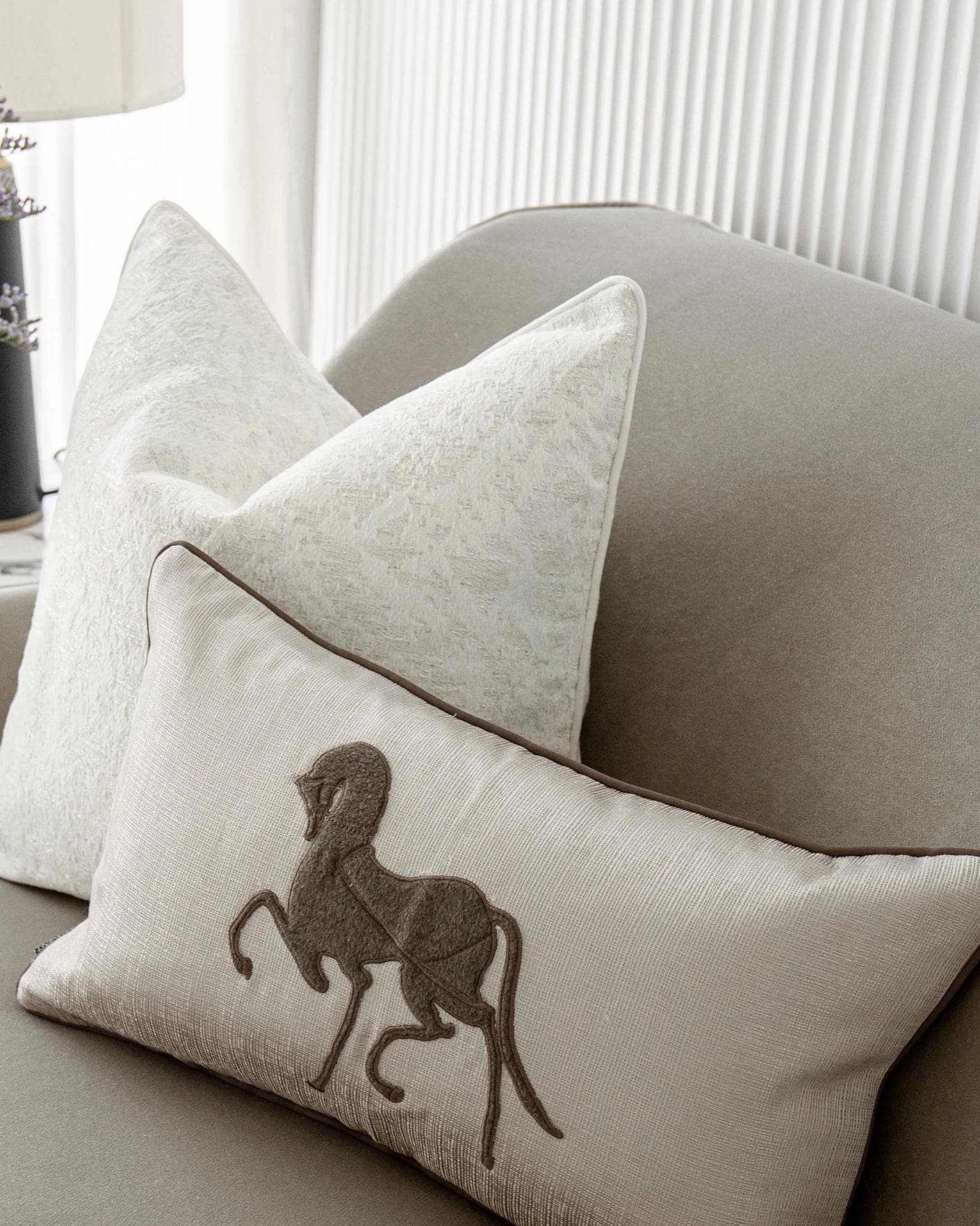 Luther Bundle cushion in white, brown and beige, shown in a lifestyle right view as image 5