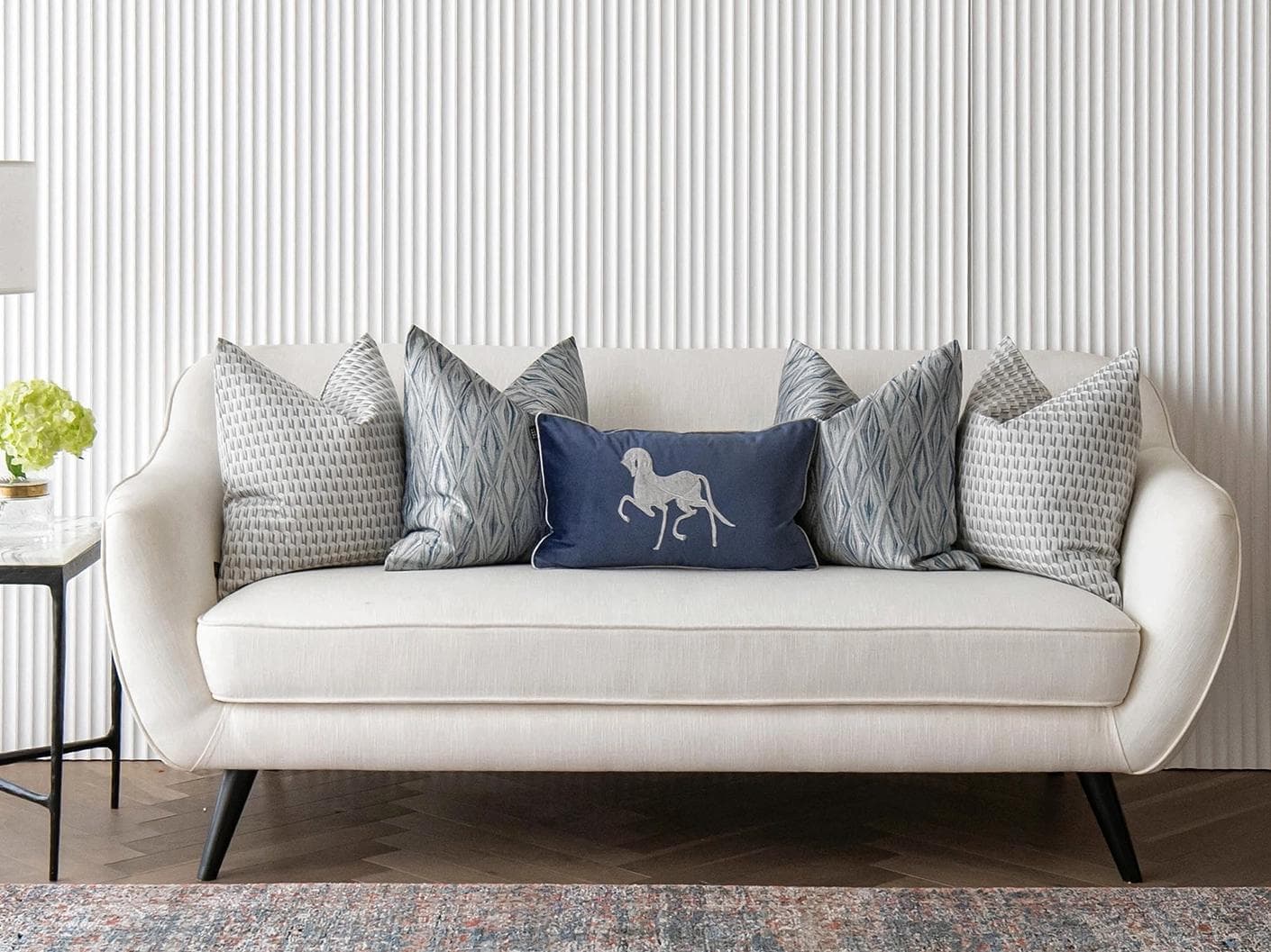 Edwin Bundle cushion in blue, silver and white, shown in a lifestyle front view as image 4