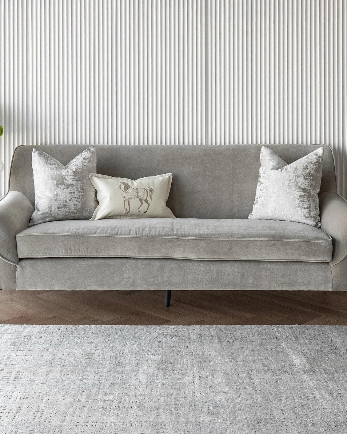 Klaus Bundle cushion in silver, grey and white, shown in a lifestyle front view as image 4